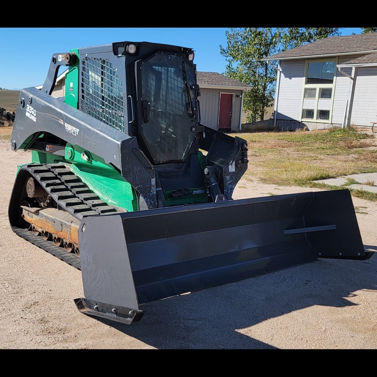 John Deere 331G compact track loader with 108-inch snow pusher, three-quarter left view