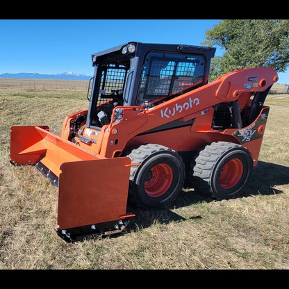 Kubota SSV75 skid steer with 92-inch orange snow pusher, front three-quarter view
