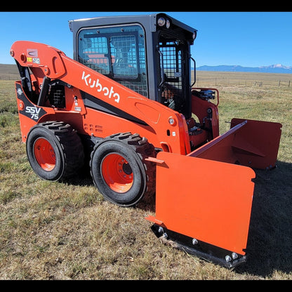 Kubota SSV75 skid steer with 92-inch orange snow pusher, three-quarter side view