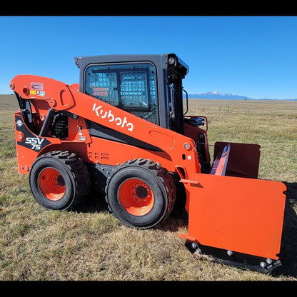 Kubota SSV75 skid steer with 92-inch orange snow pusher, side profile